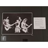 A framed limited edition Rolling Stones montage, comprising a black and white photograph of Mick