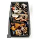 An assorted collection of items to include brass vesta case, case medallions, pipes, match holders