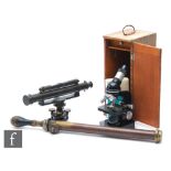 A 20th Century surveyor's level by J Halden & Co London, a post 1950s microscope in oak case and a