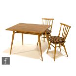An Ercol model 393 breakfast table of rectangular form, with elm top over tapered beech legs