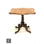 A small Victorian figured walnut centre table on turned pedestal and four scroll legs, width 61cm.