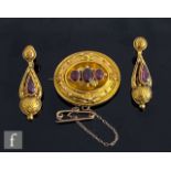 A 19th Century brooch set with three almandine garnets to centre, weight 8.5g, unmarked probably