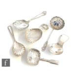 Five hallmarked silver Georgian and later caddy spoons to include shell bowl examples, with a