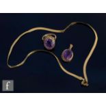 A 9ct foxtail link chain, weight 3g, with a 9ct mounted amethyst pendant and a 9ct amethyst ring,