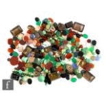 A parcel lot of assorted loose cut and polished stones to include rose and smoky quartz,