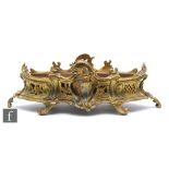 A late 19th Century French gilt metal planter of oval pierced acanthus form, on scroll feet,