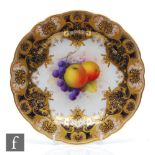 A 1920s Royal Worcester cabinet plate decorated by Shuck with a hand painted apples and red grapes