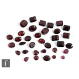Thirty four loose cut and polished garnets to include oval, marquise and canted emerald cut