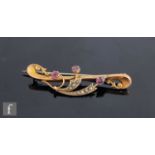 An early 20th Century 9ct hallmarked bar brooch set with amethyst and seed pearls, weight 2.5g,