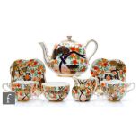 A late 19th Century Coalport tea for two decorated with an Imari pattern comprising teapot, two