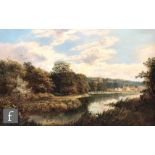 EDMUND JOHN NIEMANN (1813-1876) - A river landscape with distant church and village, oil on