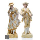 A pair of large late 19th to early 20th Century continental bisque figurines of a lady and gentleman