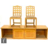Five later 20th Century light oak chairs in the manner of the Chartwell chair by Heal and Son Ltd,