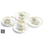 Four 19th Century Meissen teacups and saucers, each with hand painted fruit and floral sprays with