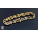 A 9ct hallmarked rope twist bracelet detailed with fifty individually set diamonds, terminating in