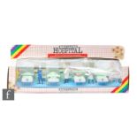 A Britains Hospital 7857 Hospital Ward Set, comprising four beds with patients, bedside tables and
