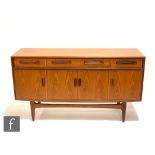 A 1970s G-Plan Fresco range teak sideboard, fitted with an arrangement of four drawers above a