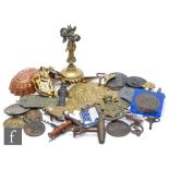 A brass Milner’s fire safe plaque, furniture handles, fly ash tray, various corkscrews and metal