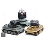 Three 1:16 scale remote control models of tanks, all with handsets.