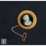 A 19th Century 18ct mounted hardstone cameo, profile of a classical maiden to a black ground, weight