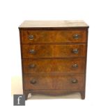 A small mahogany chest of four long drawers in the Georgian style, oval brass drop handles,