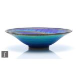 A large contemporary studio pottery bowl by Simon Rich decorated in an azurite blue with green