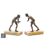 A pair of 20th Century bronze bookends, modelled as a nude male in running pose, mounted to a