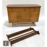 An Ercol Furniture model 351 elm and beech sideboard, designed by Lucian Ercolani, fitted with two
