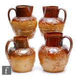 Four 19th Century salt glazed stoneware water jugs each decorated with relief tavern and hunting