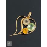 An 18ct pendant modelled as a stylised heart set with citrine, mandarin citrine and green quartz,
