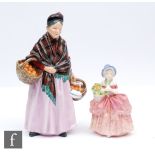 Two Royal Doulton figurines comprising The Orange Lady HN1759 and Cissie HN1809, both with printed