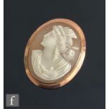 An early 20th Century 9ct mounted oval cameo brooch, head and shoulder portrait of a classical