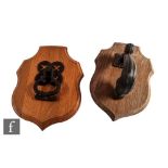 Two late Victorian cast iron door knockers, the first with a quatrefoil pierced back and trefoil