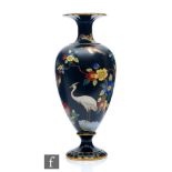 A 1920s Wiltshaw and Robinson Carlton Ware cloisonne vase with chinoiserie decoration against a