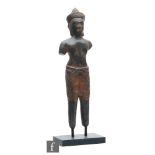 A Burmese figure of a Nat, the patinated bronze figure modelled in standing position, wearing