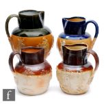 Four 19th Century salt glazed stoneware water jugs of varying form each with relief tavern and