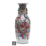 A Chinese 19th Century Canton famille rose vase of baluster form, the neck extending to a flared and