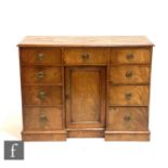A small 19th Century inverted breakfront sideboard, the central cupboard surrounded by an