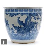 A Chinese blue and white porcelain fish bowl, the large vessel decorated to the exterior with a