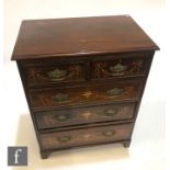 A late 19th Century marquetry inlaid mahogany chest of two short and three long drawers, brass