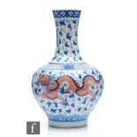 A Chinese Wucai style vase, the porcelain bottle vase with underglazed blue and overglazed red