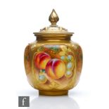 A Royal Worcester Fallen Fruits shape H162 vase and cover panel decorated by Roberts with hand