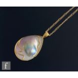 A 18ct mounted mabe mother of pearl tear shaped pendant, weight 16g, length 5.5cm, suspended from
