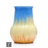 A Ruskin Pottery crystalline glaze vase of globe and shaft form decorated in a blue to yellow to