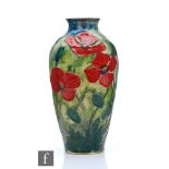 A contemporary studio pottery vase by Jonathan Cox, decorated with tubelined and hand painted