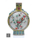 A Chinese yellow ground famille rose moonflask, the porcelain flask rising from a high foot and