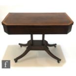 A 19th Century satinwood crossbanded mahogany tea table, the fold over canted top on four pillar