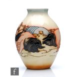 A Moorcroft Pottery vase in the Limousin Pig pattern designed by Kerry Goodwin, of footed ovoid form