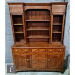 A George III and later constructed oak dresser, the cupboard rack over three frieze and three