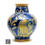 A late 19th to early 20th Century faience maiolica vase in the manner of Urbino decorated in the